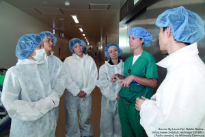 Lt. Cmdr. Christina L. Telez, second from right, leads a tour through operating rooms for the visiting physicians and students from the University of the Ryukyus Sept. 12 at U.S. Naval Hospital on Camp Foster. Telez escorted the visitors through a vacant operating room to introduce them to the various equipment used in surgery. Telez is the department head of the main operating room at USNH Okinawa. (Photo by Lance Cpl. Natalie M. Rostran)